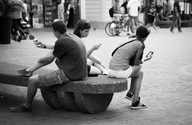 People looking at their phones