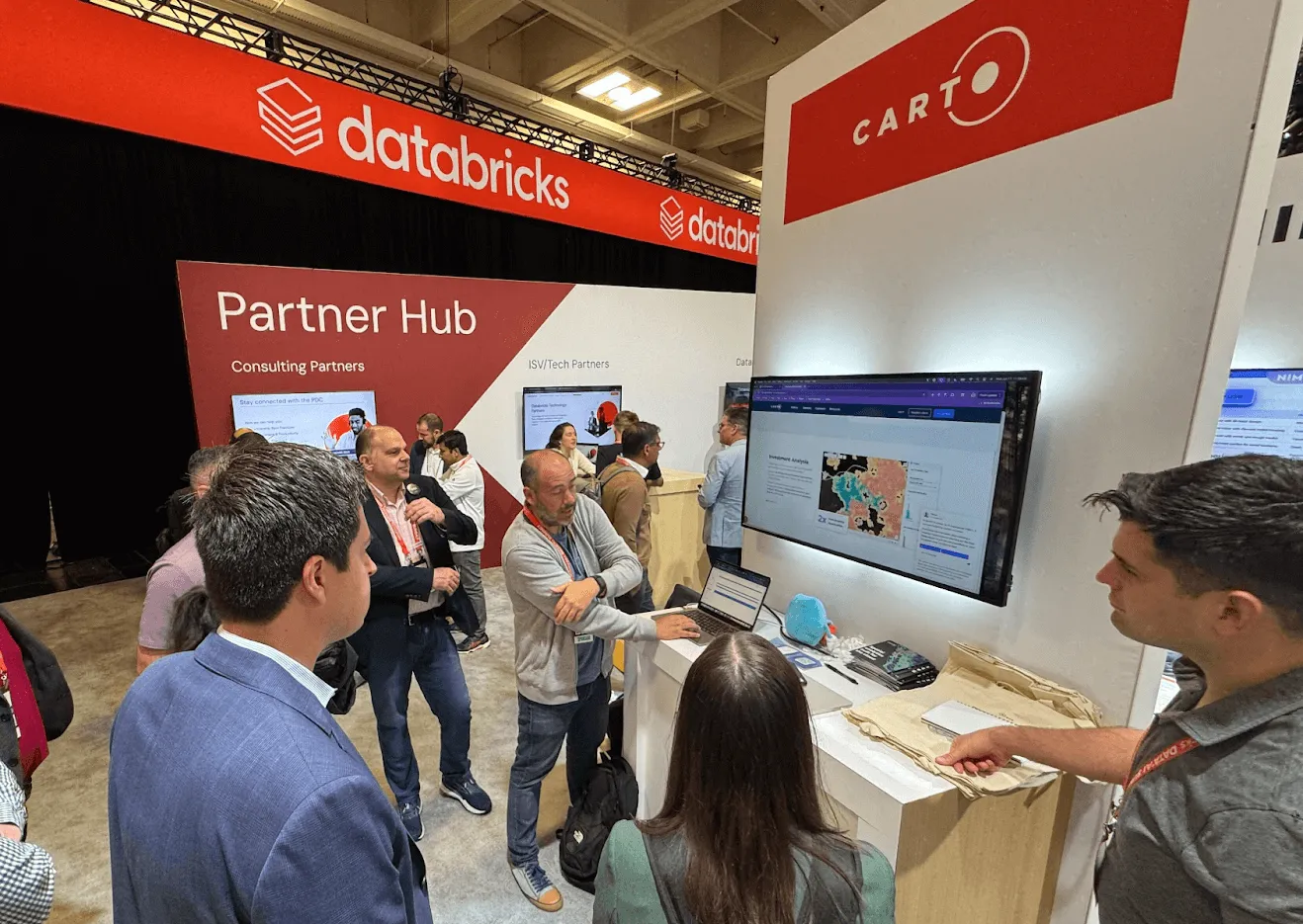 A photo of the CARTO team at the Databricks event booth